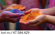 Colorful Celebration of Holi Festival With Young People Enjoying Vibrant Gulal Powder in Their Hands During Spring Festivities. Стоковое AI-изображение, AI-художник Sergey Grishin / Фотобанк Лори