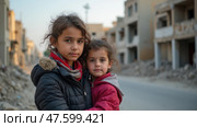 Two Young Girls Stand Close, Looking at the Camera, in a Devastated Neighborhood. Стоковое AI-изображение, AI-художник Sergey Grishin / Фотобанк Лори