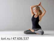 A woman doing yoga, stretching, pacification, calmness. Стоковое AI-изображение, AI-художник Ирина Ручушкина / Фотобанк Лори