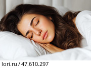 Young woman peacefully sleeping on a bed with white pillows in natural light. Молодая женщина мирно спит на кровати с белыми подушками при естественном освещении. Стоковое AI-изображение, AI-художник Katsiaryna Repich / Фотобанк Лори