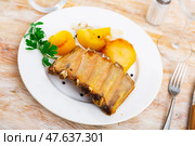 Nicely laid out dish of pork ribs with potatoes siding. Стоковое фото, фотограф Яков Филимонов / Фотобанк Лори