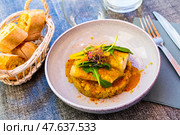 Codfish baked with curry and served with quinoa and greens. Стоковое фото, фотограф Яков Филимонов / Фотобанк Лори