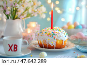 Пасхальный кулич с горящей свечой. Стоковое AI-изображение, AI-художник Щеголева Ольга / Фотобанк Лори