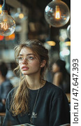 Girl in cafe setting gazing at Edison bulbs, contemplative and illuminated, after API quota error. Стоковое AI-видео, аниматор Данила Большаков / Фотобанк Лори