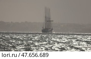 Majestic four masted sailing ship navigating calm waters. Стоковое видео, видеограф Константин Шишкин / Фотобанк Лори