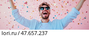 Euphoric Moment: Man Celebrating with Confetti, Joyful Festivity & Achievement, Ideal for a Greeting Card or Event Promotion. Стоковое AI-изображение, AI-художник Данила Большаков / Фотобанк Лори