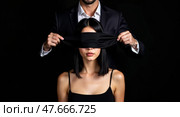 Dramatic portrait of binding and blindfold. Стоковое AI-изображение, AI-художник Андрей Бакусов / Фотобанк Лори