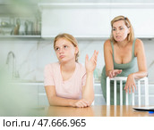 Angry mother yells at teenage girl sad daughter. Стоковое фото, фотограф Яков Филимонов / Фотобанк Лори