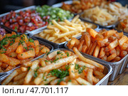 Delicious variety of fries displayed in paper bags at a food location. Красочное ассорти картофеля фри представлено в бумажных пакетах: сладкий картофель фри, кудрявый картофель фри и классический золотистый картофель фри. Идеально подходит для любителей перекусить в заведениях повседневного питания. Стоковое AI-изображение, AI-художник Katsiaryna Repich / Фотобанк Лори