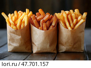 Delicious variety of fries displayed in paper bags at a food location. Красочное ассорти картофеля фри представлено в бумажных пакетах: сладкий картофель фри, кудрявый картофель фри и классический золотистый картофель фри. Идеально подходит для любителей перекусить в заведениях повседневного питания. Стоковое AI-изображение, AI-художник Katsiaryna Repich / Фотобанк Лори