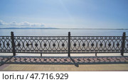 Embankment with a black fence. View of the river in motion. Стоковое видео, видеограф Mikhail Davidovich / Фотобанк Лори