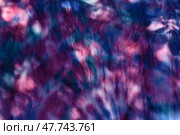 Abstract painted background. Multi-colored pattern in the shibori technique on a thin knitted fabric. Multi-color texture. batik.Textile shibori. Ткань окрашена методом узелковый батик. Пятна света и тени. Стоковое фото, фотограф Ольга Солопова / Фотобанк Лори