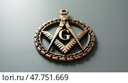 Intricate bronzed masonic emblem with letter g. Стоковое AI-изображение, AI-художник Андрей Бакусов / Фотобанк Лори