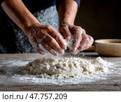 Hands kneading flour on wooden table during traditional dough preparation process. Стоковое AI-изображение, AI-художник Гайфуллина Дина / Фотобанк Лори