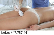 Aesthetician administering ice hammer therapy to help tighten skin and promoting elasticity on female client buttocks in cosmetology clinic. Effective hardware body care procedure. Стоковое видео, видеограф Яков Филимонов / Фотобанк Лори
