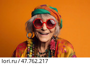 Whimsical and outlandish elderly woman donning stylish sunglasses and colorful headscarf, playfully posing on vibrant orange background. Spirited senior lady in her sixties embracing joy and celebration. Стоковое AI-изображение, AI-художник Данила Большаков / Фотобанк Лори