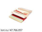 Stack of books in colour covers with white sheets isolated on a white background. Стоковое фото, фотограф Елена  Попкова / Фотобанк Лори