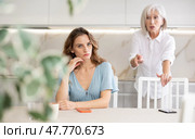 Aggrieved woman having quarrel with her daughter at home. Elderly mother expresses claims to adult daughter. Стоковое фото, фотограф Яков Филимонов / Фотобанк Лори
