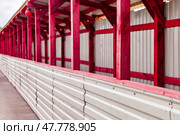 Construction Site With Vibrant Red Wooden Frames and Corrugated Walls for New Building Project. Стоковое фото, фотограф Aleksandr Golubev / Фотобанк Лори