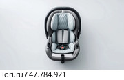Baby car seatclean minimalist layout, top view, minimalist style. Детское автокресло, минималистичный дизайн, вид сверху, минималистичный стиль. Стоковое AI-изображение, AI-художник Katsiaryna Repich / Фотобанк Лори