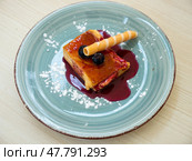 Slice of delicious cake with cheese mousse with blueberry topping on plate. Spanish dessert tarta de queso con arandano. Стоковое фото, фотограф Яков Филимонов / Фотобанк Лори