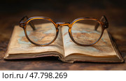 A pair of vintage glasses sits atop an aged map, suggesting a journey through history and geography, perfect for curious wanderers. Стоковое AI-изображение, AI-художник Данила Большаков / Фотобанк Лори