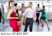 Man and woman practicing swing dance in dancing studio. Стоковое фото, фотограф Яков Филимонов / Фотобанк Лори