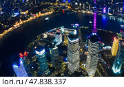 Shanghai, China - 1 April 2025: A stunning night view from Shanghai Tower, capturing the Oriental Pearl Tower, Huangpu River, Pudong district, and Shanghai World Financial Center. Редакционное фото, фотограф Татьяна Терехина / Фотобанк Лори