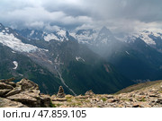View of the Great Caucasian Ridge opening from the Upper station of the cable car system of the Dombay ski resort on a summer day, Karachay-Cherkessia, Russia. Стоковое фото, фотограф Ula Ulachka / Фотобанк Лори