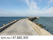 Southern long concrete pier with breakwaters on the Baltic Sea on the Vistula Spit. Baltiysk. Russia. Стоковое фото, фотограф Elena Odareeva / Фотобанк Лори