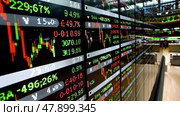 Numerous stock market data boards displaying real-time stock prices, trading volumes and market trends in a bustling stock market. Стоковое AI-изображение, AI-художник Данила Большаков / Фотобанк Лори
