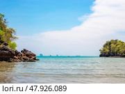 Seascape. Nopparat Thara beach with greenery rock and clear water in Krabi province, Thailand (2024 год). Стоковое фото, фотограф Коханова Наталья / Фотобанк Лори