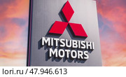 Вывеска официального дилера Mitsubishi motors на фоне тревожного багрового неба. Редакционное видео, видеограф FotograFF / Фотобанк Лори