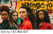 A group of women are gathered together, standing side by side in a row, looking towards the camera. Стоковое AI-изображение, AI-художник Данила Большаков / Фотобанк Лори