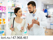 Woman asking questions about skin care product, druggist consultation. Стоковое фото, фотограф Яков Филимонов / Фотобанк Лори