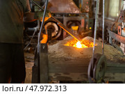 Ferrous metal billet is melted in an induction furnace closeup. Стоковое фото, фотограф Татьяна Яцевич / Фотобанк Лори