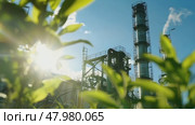 Safely generate green energy with an industrial factory and green plants, illuminated by sunlight, in the foreground. Стоковое AI-видео, аниматор Михаил Строгалев / Фотобанк Лори