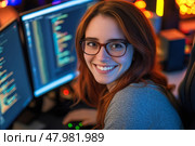 smiling female developer in glasses sitting at a desk with a computer, Стоковое AI-изображение, AI-художник Anastasy Yarmolovich / Фотобанк Лори