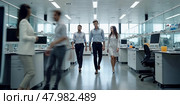 Three people walk across office open space. Two people at the foreground are out of focus. Intentional motion blur. Scientific workplace. Стоковое AI-изображение, AI-художник Катерина Ковалева / Фотобанк Лори