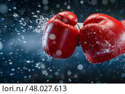 two boxing gloves clashing in a test. Стоковое фото, фотограф Anastasy Yarmolovich / Фотобанк Лори