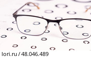 Metal frame of glasses on Golovin's table. The concept of an ophthalmologist's vision check. Glasses with lenses for vision. Optic vision correction. Стоковое фото, фотограф Скрипачев Антон / Фотобанк Лори