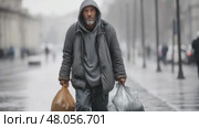 Homeless man walking on rainy city street. Стоковое AI-видео, аниматор Юрий Поздников / Фотобанк Лори