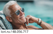 Relaxed senior man enjoying vacation by the pool. Стоковое AI-видео, аниматор Юрий Поздников / Фотобанк Лори