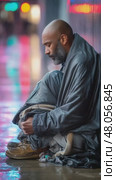 Homeless man sitting on sidewalk at night. Стоковое AI-видео, аниматор Юрий Поздников / Фотобанк Лори