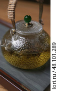 An Elegant Glass Teapot Ideal for Preparing and Serving Various Herbal Infusions. Стоковое фото, фотограф David Kashakhi / Фотобанк Лори