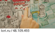 A hand points to a church tower on a mural in a coastal Italian village Atrani. Стоковое видео, видеограф Ольга Сухарева / Фотобанк Лори