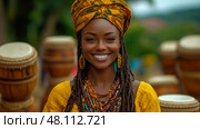 Woman wearing a vibrant head wrap and jewelry smiles warmly at a cultural festival featuring traditional drumming and lively activities. Стоковое AI-изображение, AI-художник Данила Большаков / Фотобанк Лори