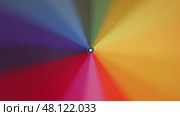 Multi-colored rainbow umbrella rotate. Стоковое видео, видеограф Михаил Коханчиков / Фотобанк Лори