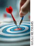 Dart Player Retrieves Darts From Blue and White Target During Competitive Match. Стоковое AI-изображение, AI-художник Юлия Гапеенко / Фотобанк Лори