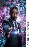 A man in formal attire interacts with vibrant digital graphics, projecting an aura of confidence and innovation. Стоковое AI-изображение, AI-художник Данила Большаков / Фотобанк Лори